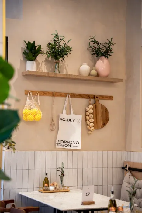 Lemon mesh bag, "Proudly a Morning Person" tote and styled shelf at Eggstatic Oakville