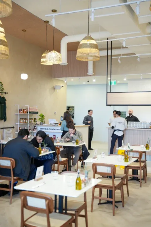 Eggstatic Waterdown dining hall with rattan pendant lights and open service counter