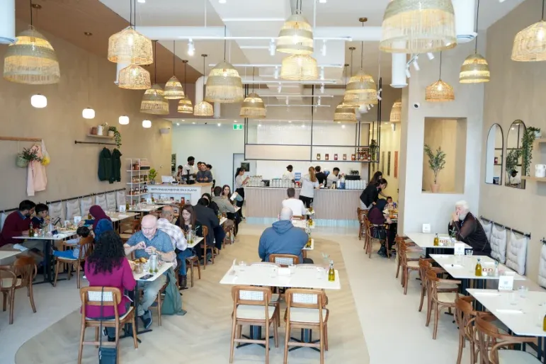 Eggstatic Waterdown busy brunch service with rattan pendants and full dining room