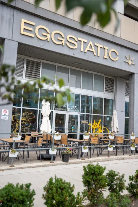 Eggstatic Scarborough storefront on Consumers Road with sidewalk patio and signature yellow bike