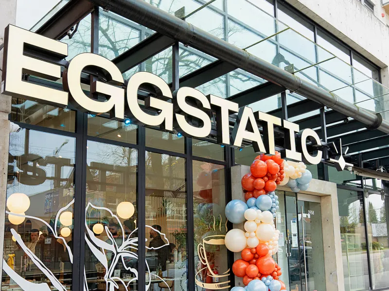 Eggstatic storefront exterior with celebration balloons
